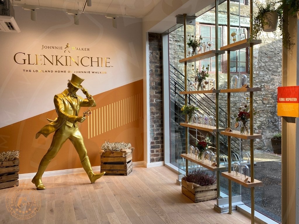 Johnnie Walker Striding Man and display of local herbs