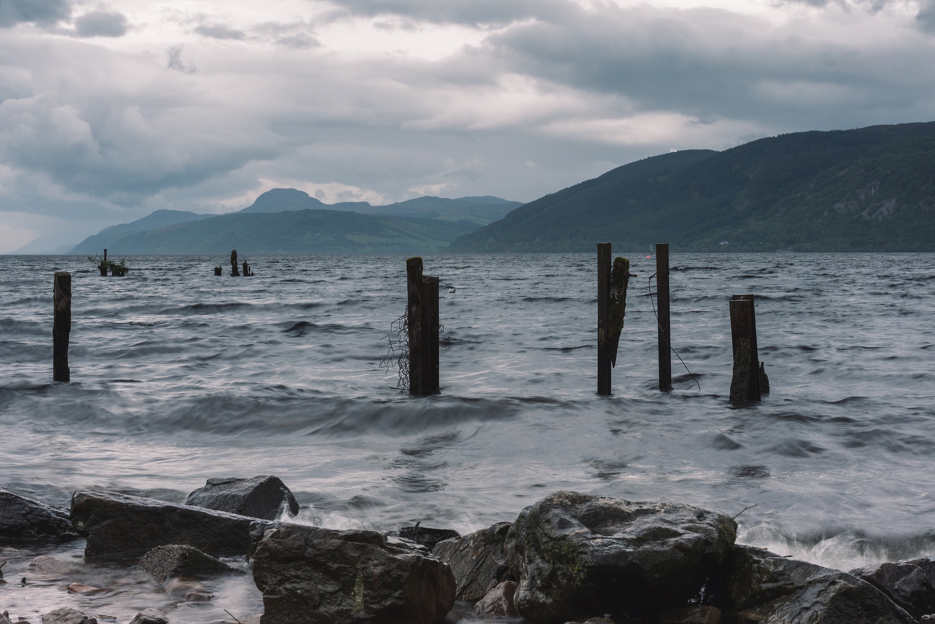 Loch Ness on a moody day with the mountains behind